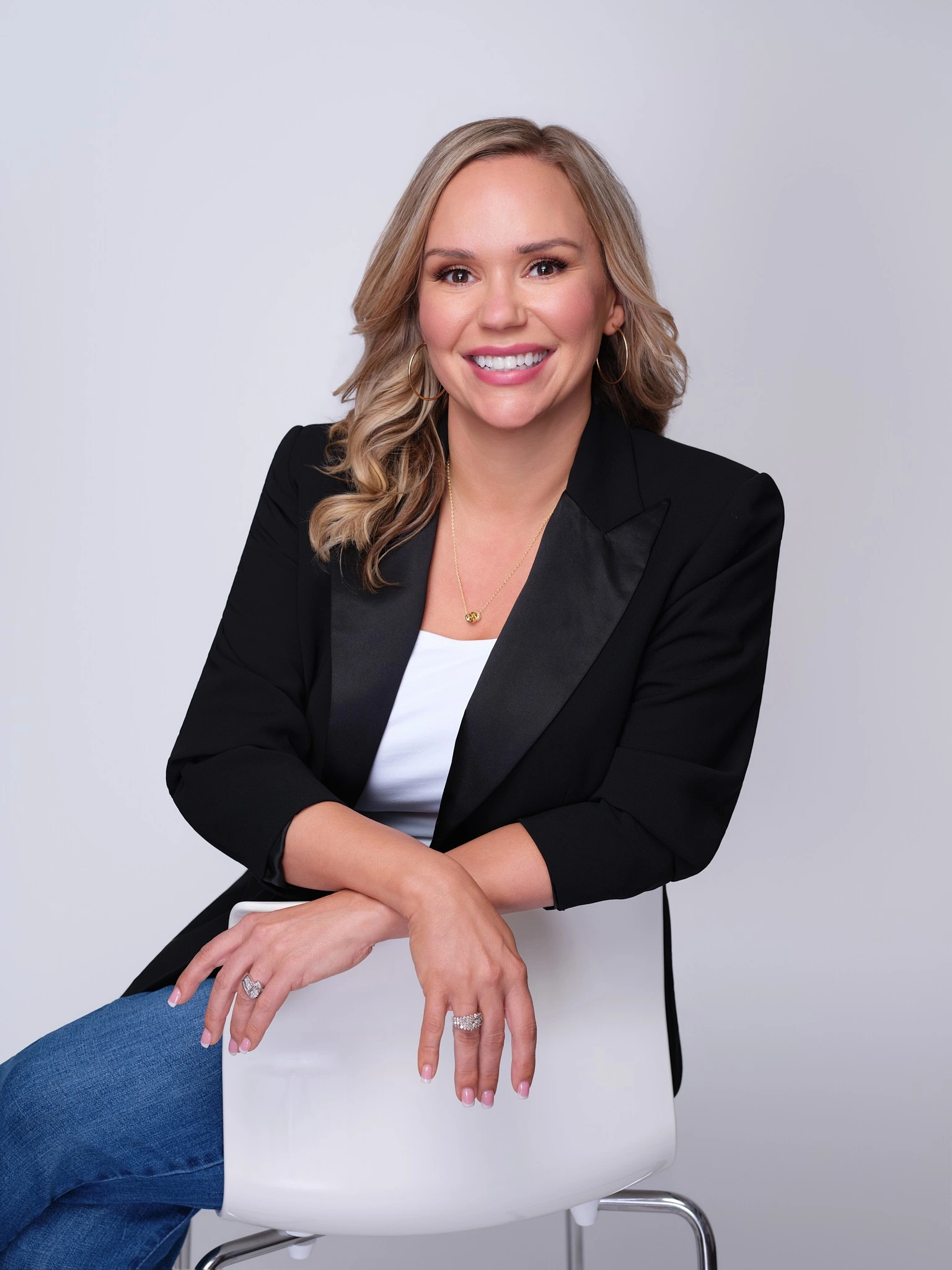 Ashlee Morris seated in a black blazer